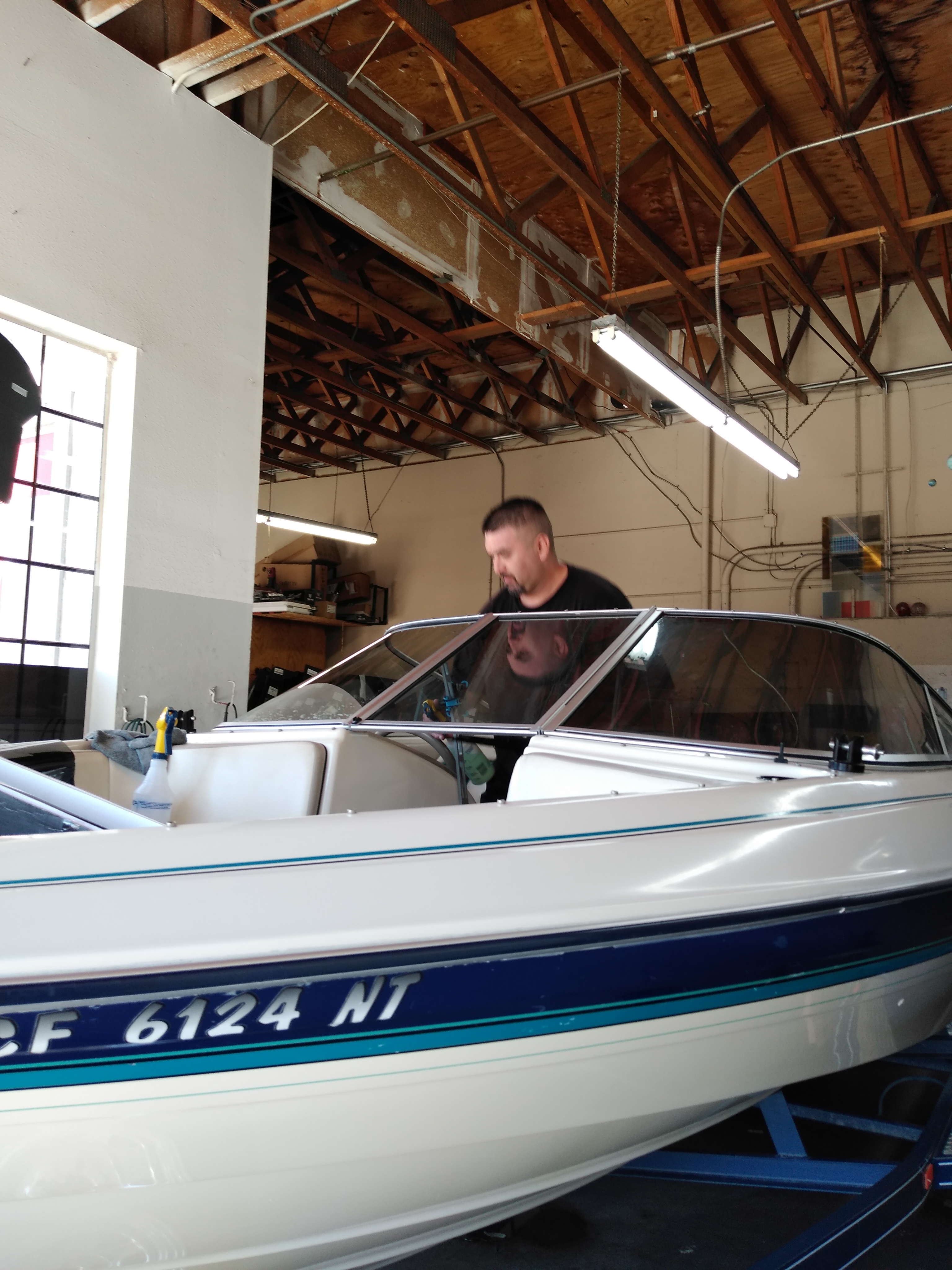 A boat with freshly tinted windows out on the water