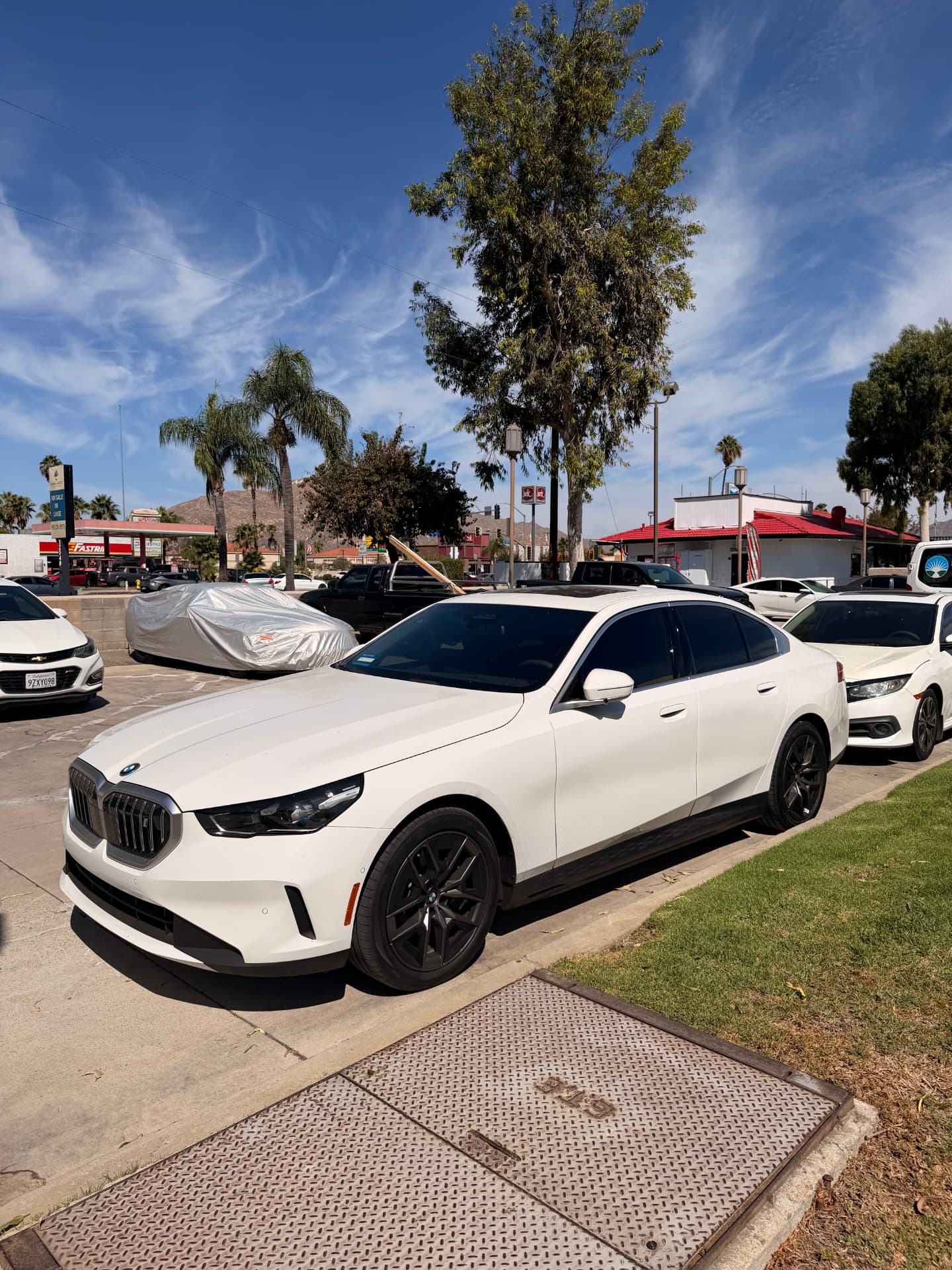 White BMW 5 Series with fresh window tint